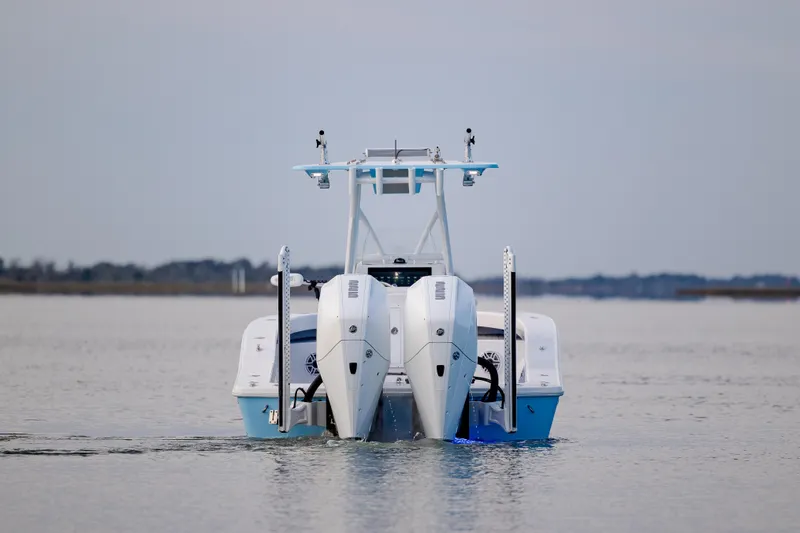 Slide: The Image of ZCB 26 Freemason 2021 boat with dual engines on calm water. - 11