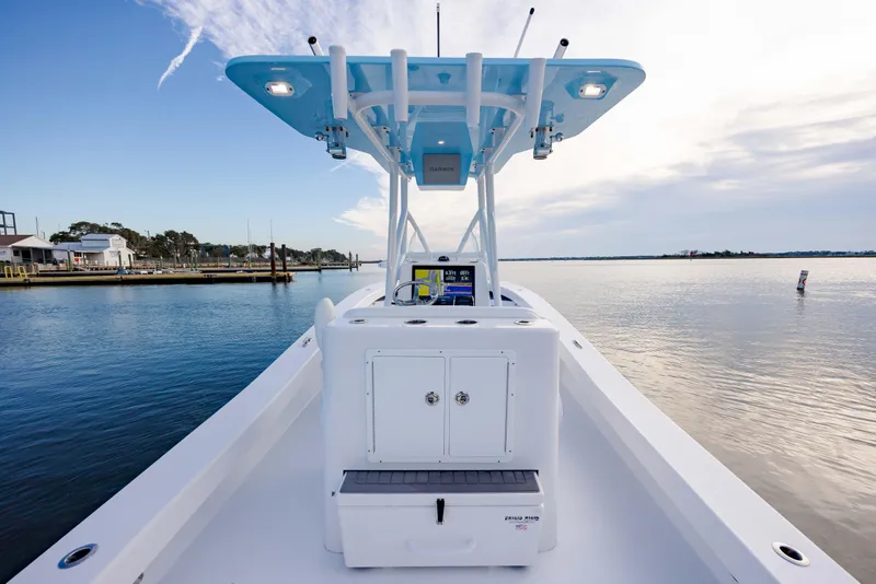 Slide: The Image of 2021 ZCB 26 Freemason boat on calm water, featuring a modern helm and T-top. - 13