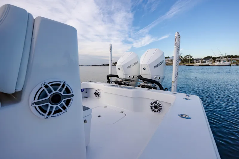 Slide: The Image of ZCB 26 Freemason 2021 boat with dual Mercury engines on calm water. - 17