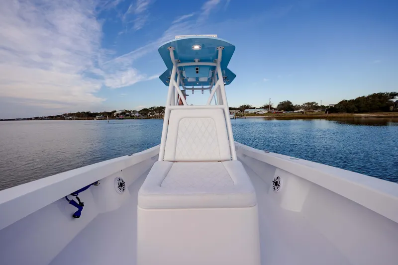 Slide: The Image of 2021 ZCB 26 Freemason boat on calm water, featuring a sleek design and spacious seating. - 19