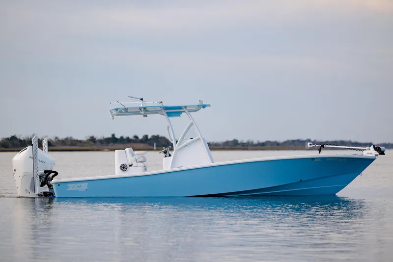 Slide: The Image of 2021 ZCB 26 Freemason boat on calm water, featuring a sleek blue hull design. - 9