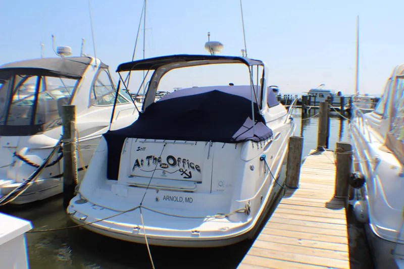 Slide: The Image of 2007 Rinker 350 Express Cruiser docked at marina, rear view. - 2