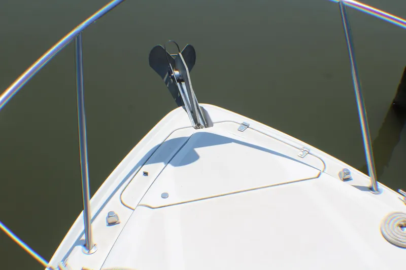 Slide: The Image of Bow of 2007 Rinker 350 Express Cruiser with anchor, stainless steel railings. - 21