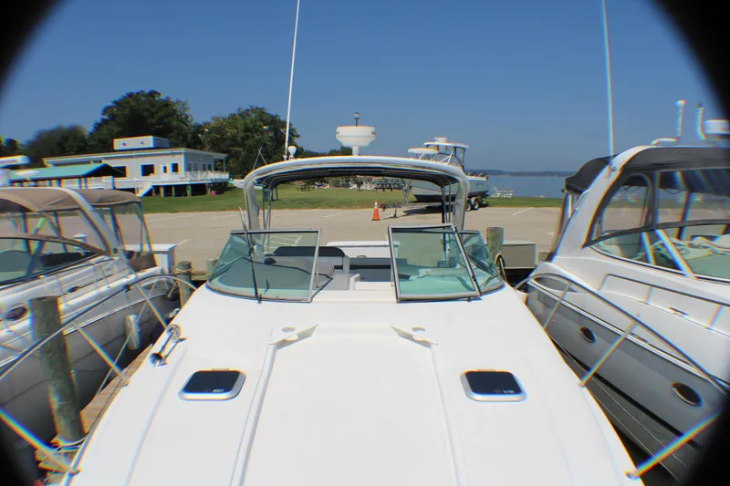 Slide: The Image of 2007 Rinker 350 Express Cruiser docked at marina, sunny day. - 22