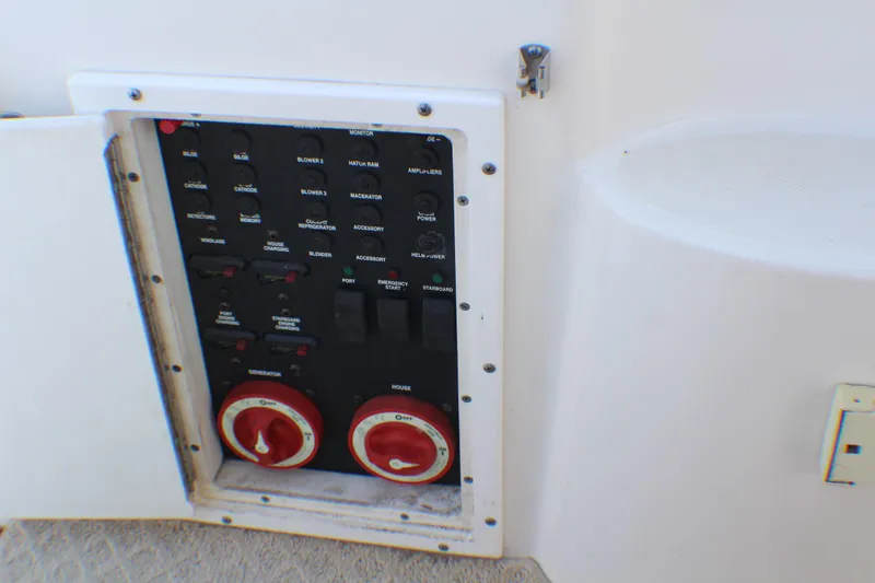 Slide: The Image of Control panel of 2007 Rinker 350 Express Cruiser with switches and dials. - 28