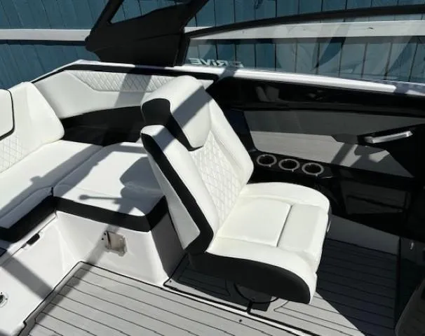 Slide: The Image of 2025 Yamaha Boats 222SD interior with white seating and modern design. - 12