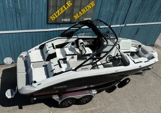 Slide: The Image of 2025 Yamaha Boats 222SD, sleek design, parked at Sizzle Marine, Ohio. - 6