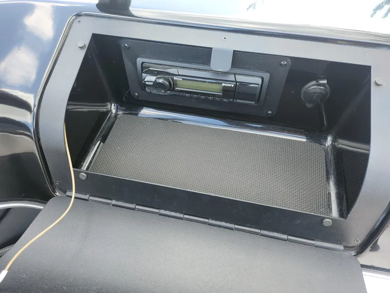 Slide: The Image of 2016 Glastron GT 205 boat dashboard with stereo system. - 15