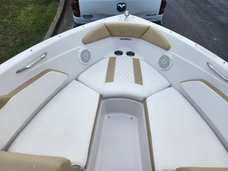 Slide: The Image of 2016 Glastron GT 205 boat interior with beige and white seating. - 18