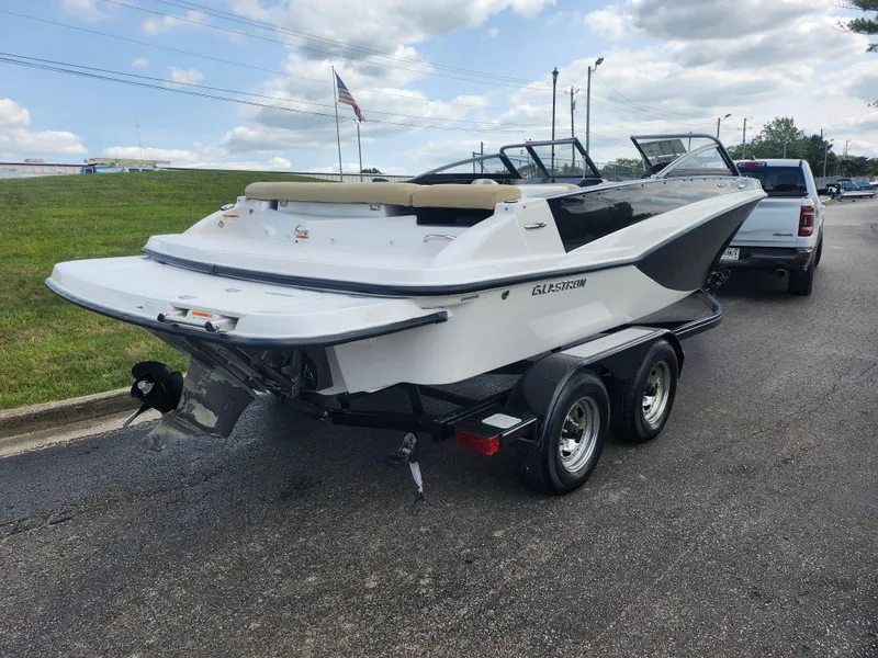 Slide: The Image of 2016 Glastron GT 205 boat on trailer, parked on roadside. - 3