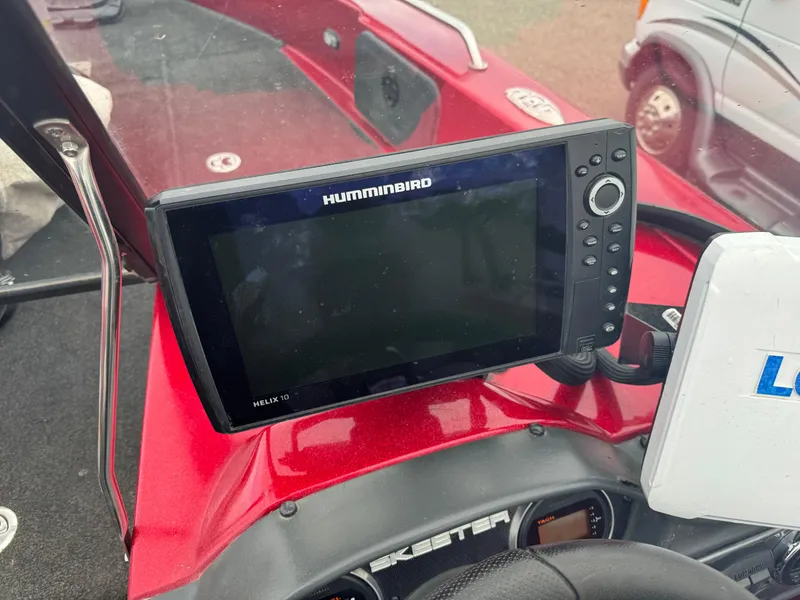 Slide: The Image of 2014 Skeeter WX 2060 boat dashboard with Humminbird Helix 10 fish finder. - 12