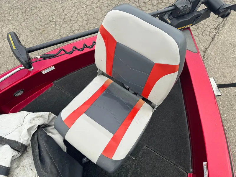 Slide: The Image of Red and gray seat on 2014 Skeeter WX 2060 boat deck. - 14
