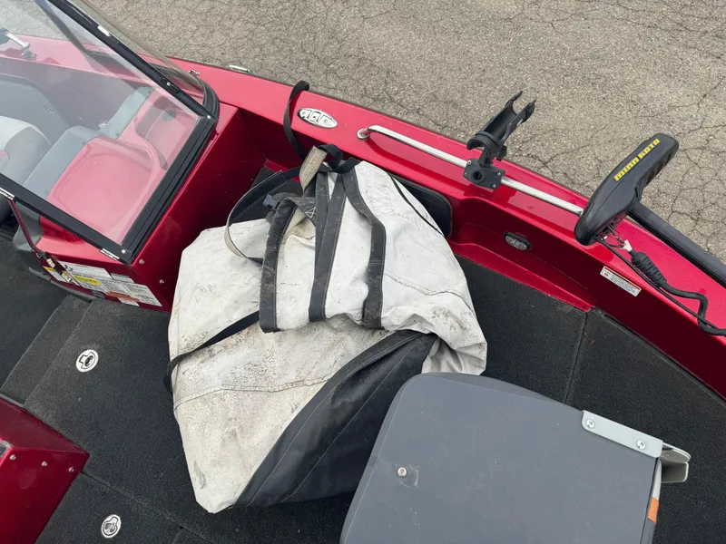 Slide: The Image of 2014 Skeeter WX 2060 boat interior with gear bag and trolling motor. - 15