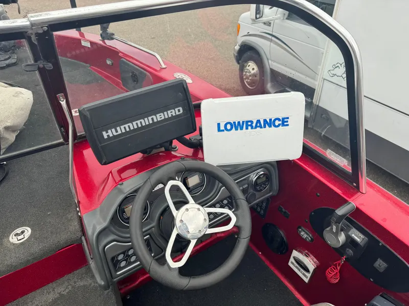 Slide: The Image of 2014 Skeeter WX 2060 boat dashboard with Humminbird and Lowrance electronics. - 5