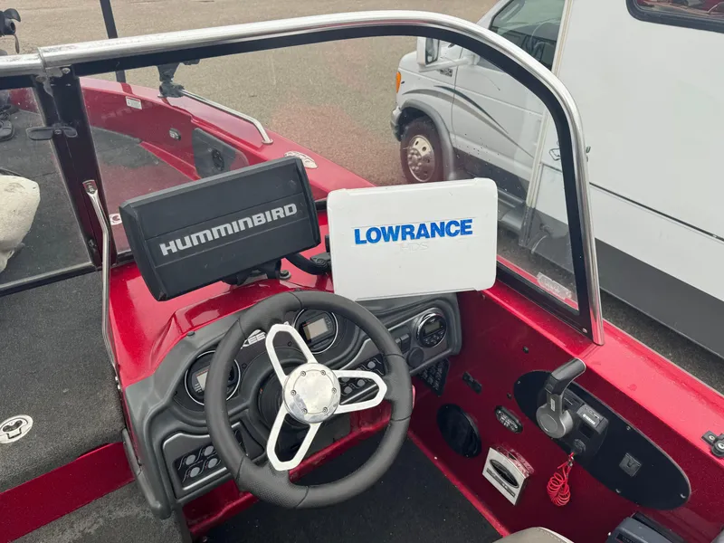 Slide: The Image of 2014 Skeeter WX 2060 boat dashboard with Humminbird and Lowrance navigation systems. - 6