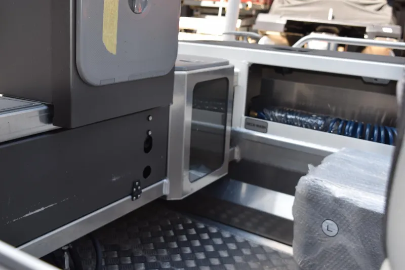 Slide: The Image of 2024 Stabicraft 1550 Frontier SportFish interior detail, showcasing storage and seating features. - 12