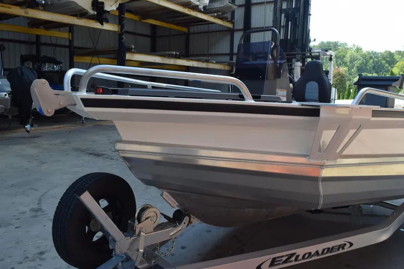 Slide: The Image of 2024 Stabicraft 1550 Frontier SportFish on EZ Loader trailer in warehouse. - 7