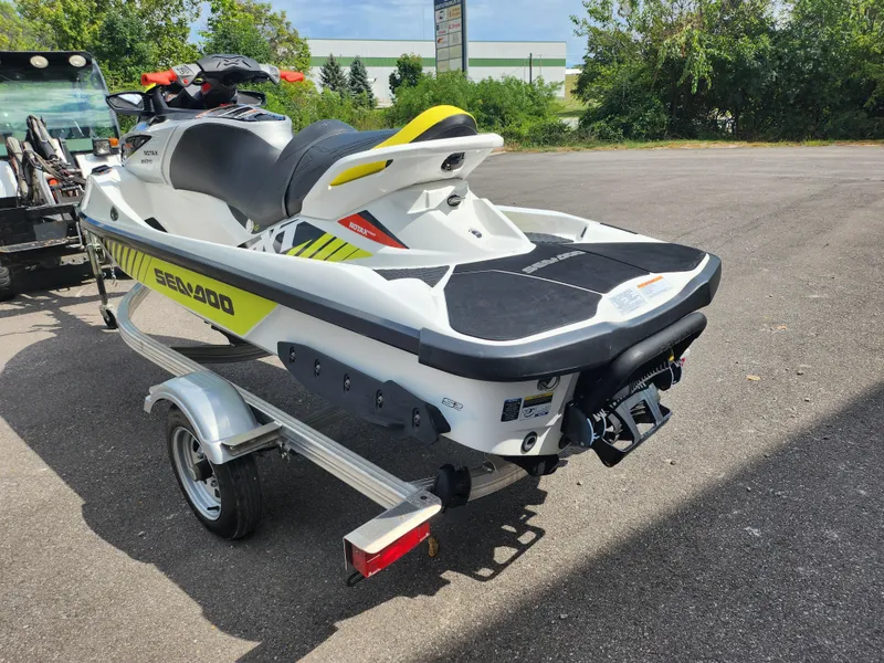 Slide: The Image of 2016 Sea-Doo RXT-X aS 260 jet ski on trailer, parked outdoors. - 1