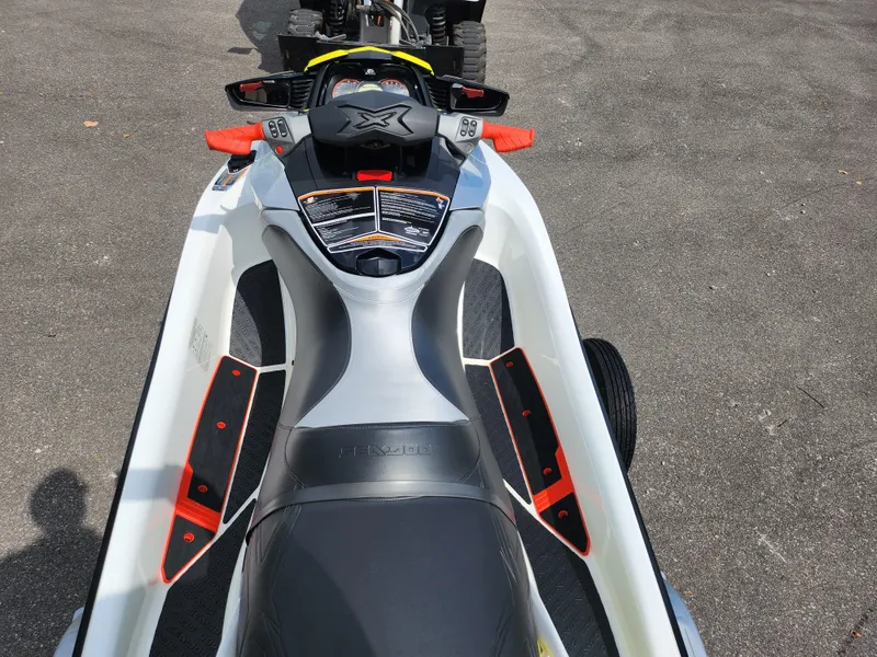 Slide: The Image of 2016 Sea-Doo RXT-X aS 260 jet ski, top view, parked on asphalt. - 10