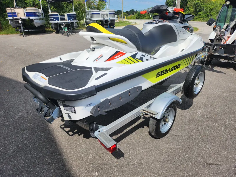 Slide: The Image of 2016 Sea-Doo RXT-X aS 260 jet ski on trailer, parked outdoors. - 3