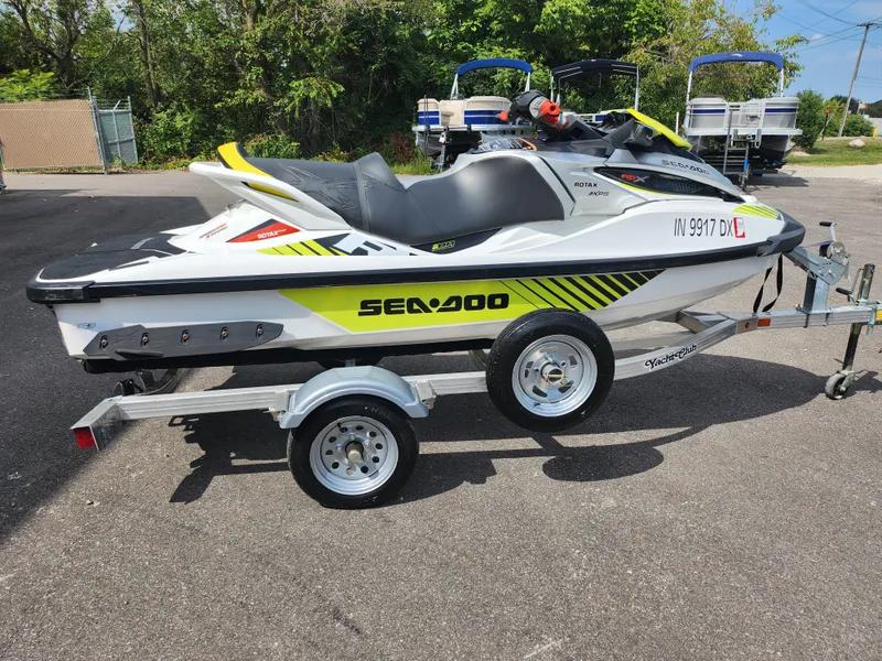 Slide: The Image of 2016 Sea-Doo RXT-X aS 260 jet ski on trailer, parked outdoors. - 4