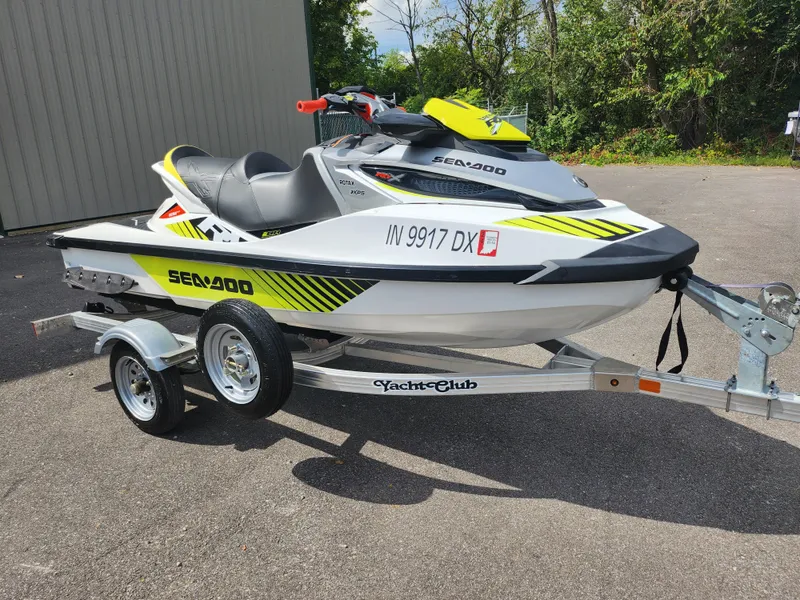 Slide: The Image of 2016 Sea-Doo RXT-X aS 260 jet ski on trailer, parked outdoors. - 5