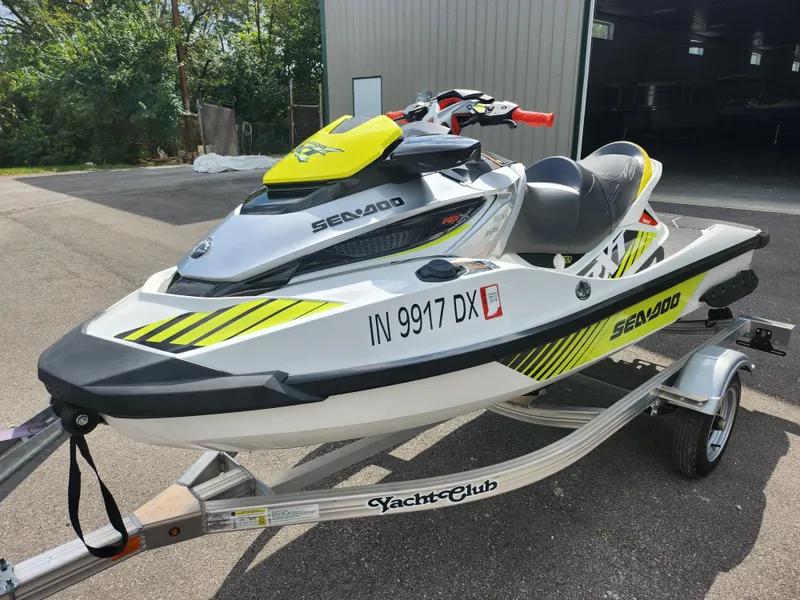 Slide: The Image of 2016 Sea-Doo RXT-X aS 260 jet ski on trailer, parked outdoors. - 8