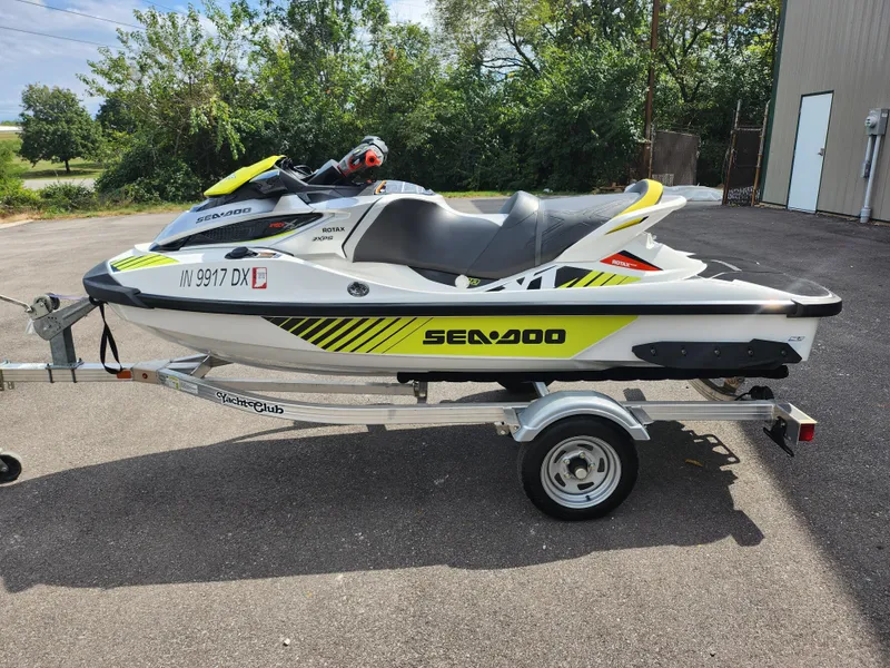 Slide: The Image of 2016 Sea-Doo RXT-X aS 260 jet ski on trailer, parked outdoors. - 9