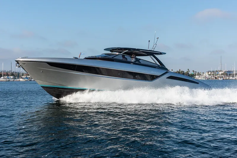 Slide: The Image of 2024 Riva 48 Dolceriva yacht cruising on open water. - 2