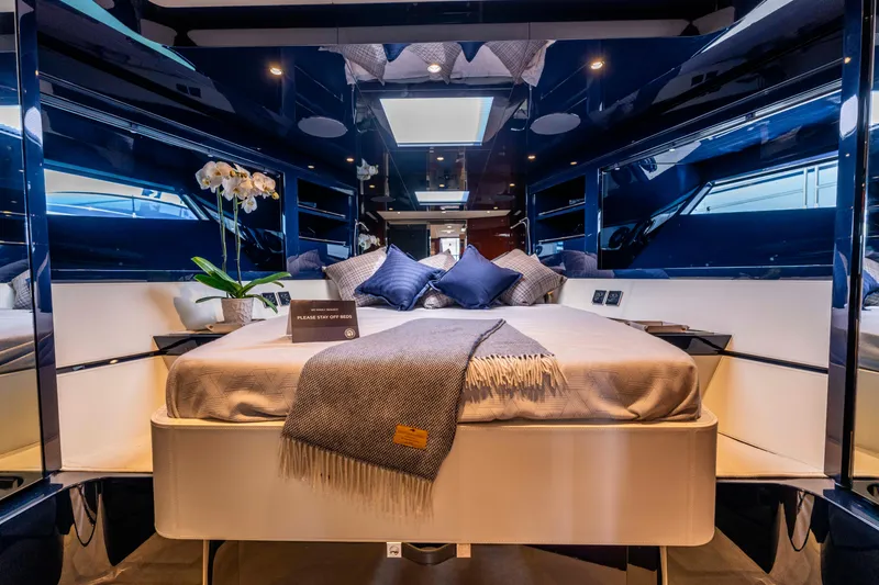 Slide: The Image of Luxurious interior of 2024 Riva 48 Dolceriva yacht with elegant bedding and modern design. - 28