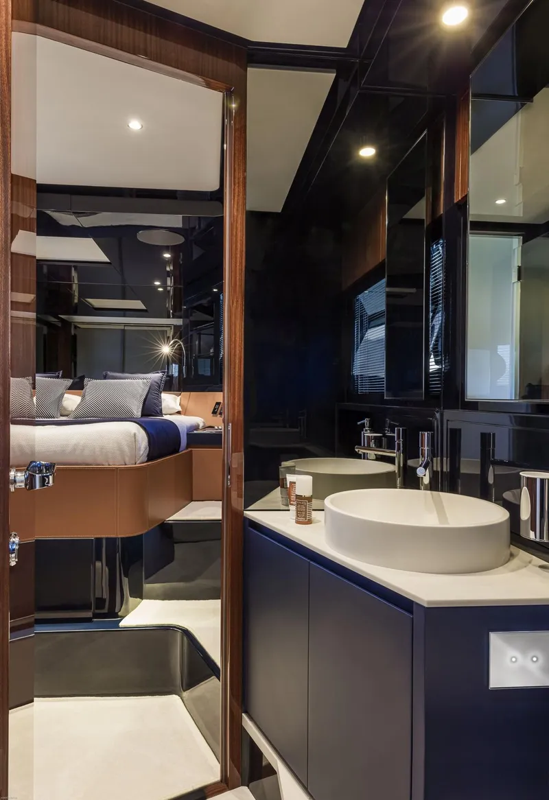 Slide: The Image of Luxurious 2024 Riva Dolceriva yacht interior with modern bathroom and elegant bedroom. - 31