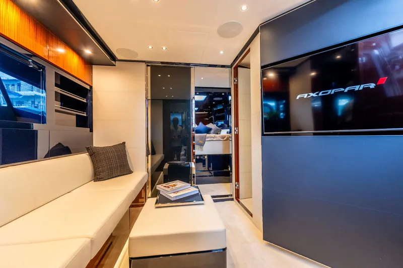 Slide: The Image of Luxurious interior of 2024 Riva 48 Dolceriva yacht with modern seating and entertainment system. - 32