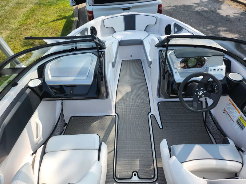Slide: The Image of 2017 Scarab 195 boat interior with modern dashboard and seating. - 12