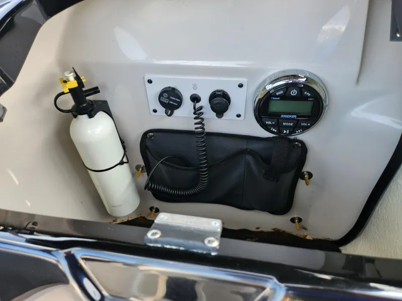 Slide: The Image of 2017 Scarab 195 dashboard with controls and fire extinguisher. - 13