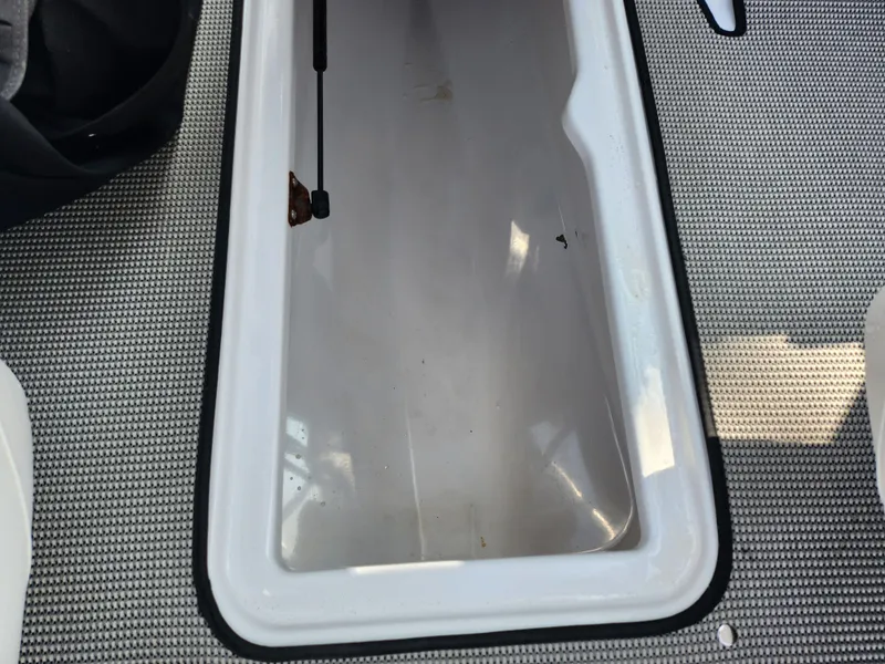 Slide: The Image of Scarab 195 boat storage compartment, 2017 model, with textured flooring. - 14