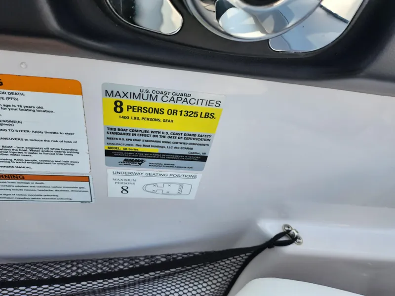 Slide: The Image of Capacity label on 2017 Scarab 195 boat, max 8 people or 1325 lbs. - 16