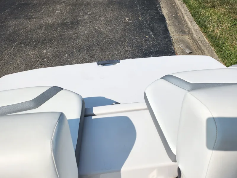 Slide: The Image of 2017 Scarab 195 boat interior with white seating and gray accents. - 23