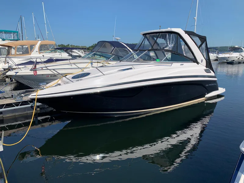 The Image of 2018 Regal 28 Express boat docked in marina, side view. - 0
