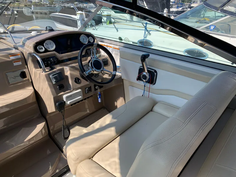 Slide: The Image of Interior of a 2018 Regal 28 Express boat with steering console. - 11