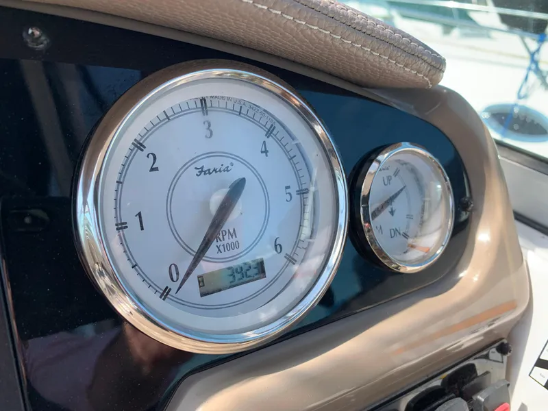 Slide: The Image of Tachometer and gauge on 2018 Regal 28 Express boat. - 13