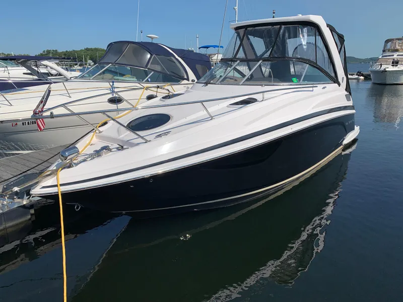 Slide: The Image of 2018 Regal 28 Express luxury motorboat docked in harbor. - 2