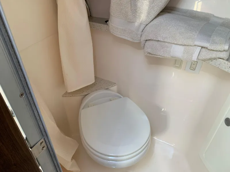 Slide: The Image of Bathroom in 2018 Regal 28 Express boat. - 27