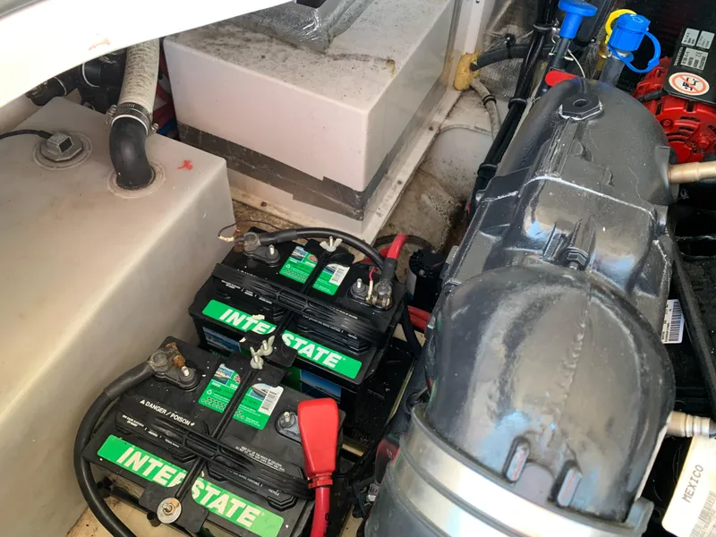 Slide: The Image of Engine compartment of 2018 Regal 28 Express with batteries. - 32