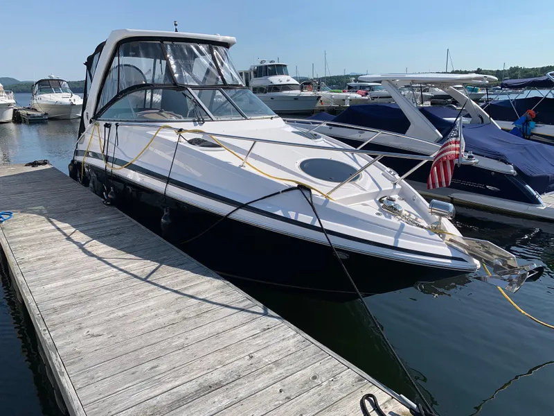 Slide: The Image of 2018 Regal 28 Express boat docked with American flag. - 4