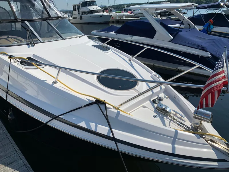 Slide: The Image of 2018 Regal 28 Express boat docked with American flag. - 5