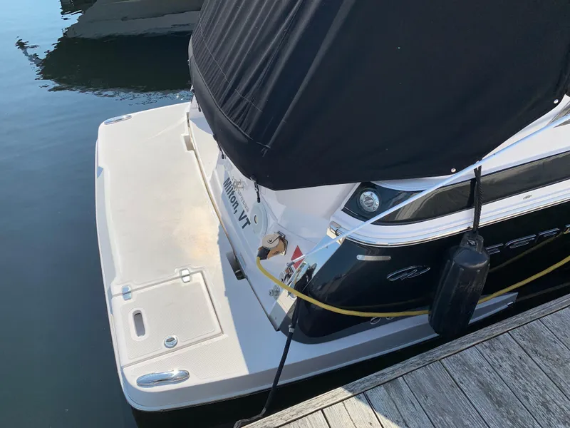 Slide: The Image of Rear view of a 2018 Regal 28 Express boat at the dock. - 7