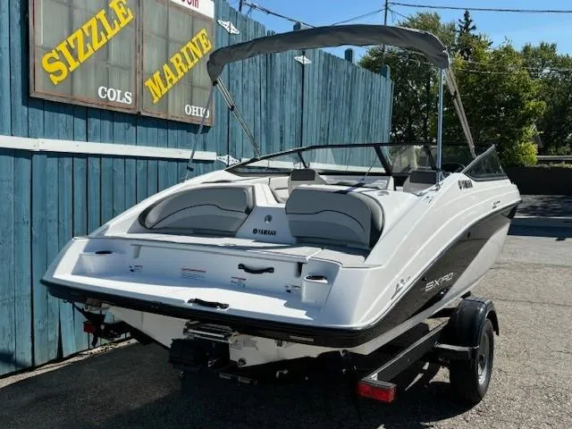 Slide: The Image of 2025 Yamaha Boats SX190 on trailer at Sizzle Marine dealership. - 2