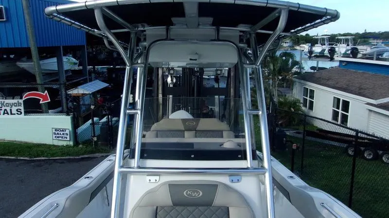 Slide: The Image of 2025 Key West 239 FS boat, sleek design, marina background. - 12
