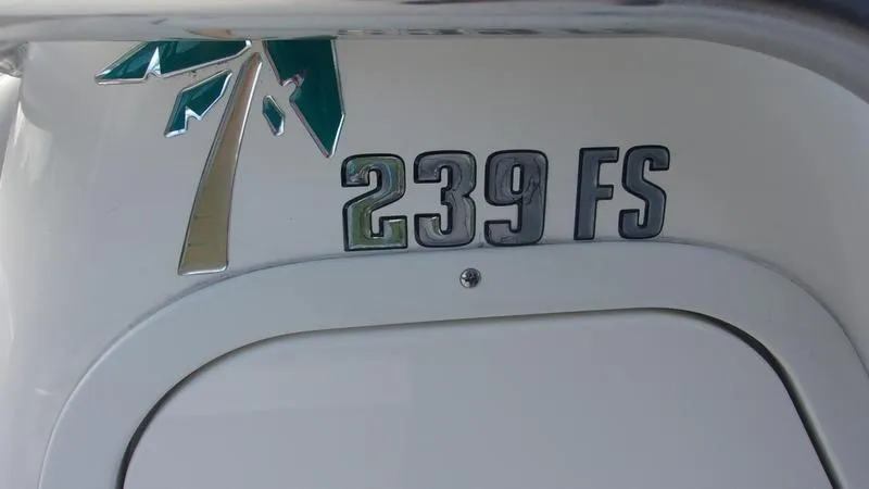 Slide: The Image of Key West 239 FS 2025 boat emblem with palm tree design. - 17