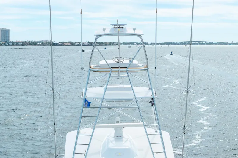 Slide: The Image of Hatteras GT60 yacht, 2010 model, cruising on open water with clear sky. - 15